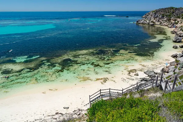 The wooden staircase down to the glossy clear waters of Parker Point Bay.