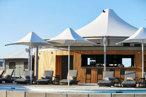 Enjoy laidback moments under the umbrellas by the pool