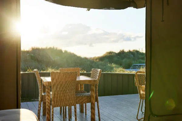 Dining area overlooking the hills from an eco-tent