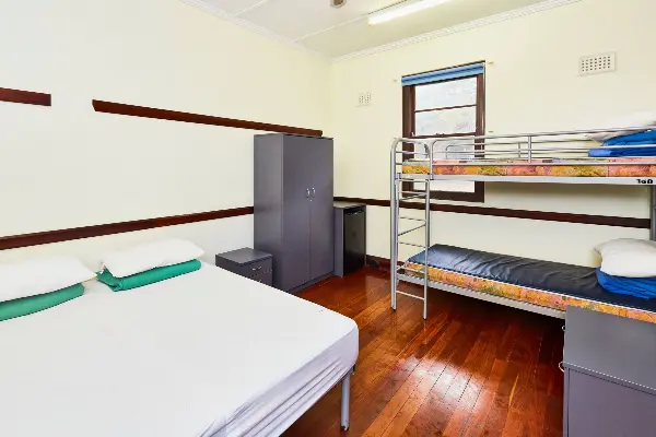 A queen bed and a bunk bed.