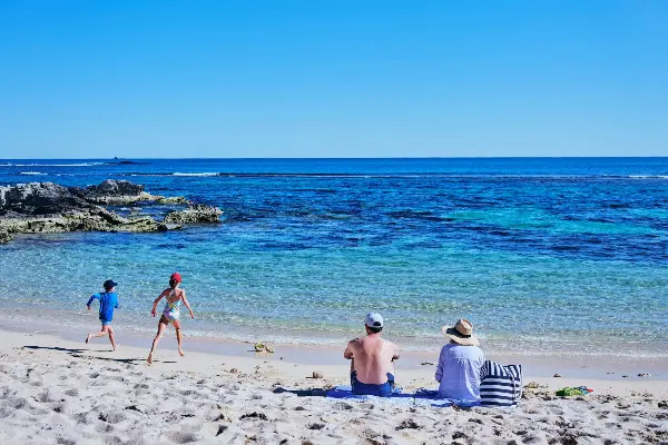 Kids going for a swim at Little Armstrong Bay.