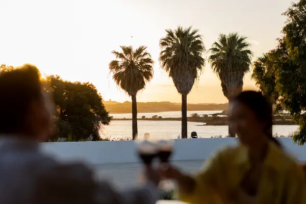 A couple enjoying drinks at Sunsets Rottnest.