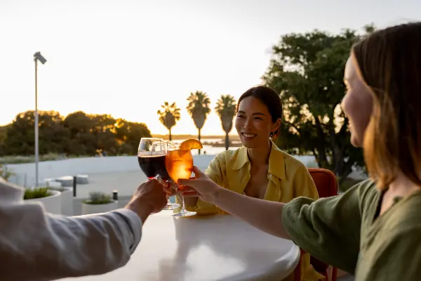 Friends celebrating with summery drinks at Rottnest Island