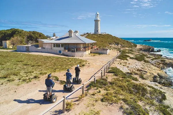 Three people on a Segway Tour WA along the coast of Wadjemup / Rottnest Island.