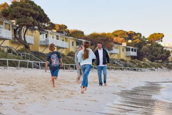 Family enjoying the beach on a cool Autumn evening at Wadjemup / Rottnest Island.