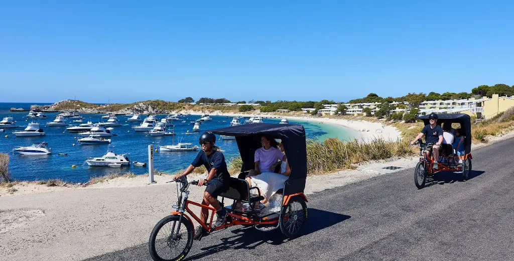 Two rickshaws riding along Geordie Bay