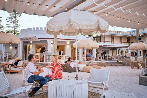 A couple celebrating with a drink at Bayside Bar.