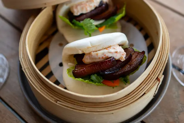 Two juicy pork belly bao buns