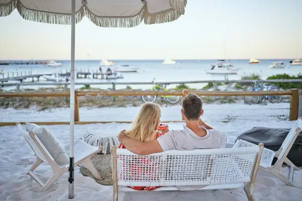 Couple sitting at The Beach Club at the Samphire