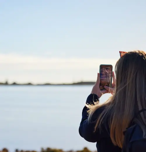 Smartreka| Female taking a photo of scenery