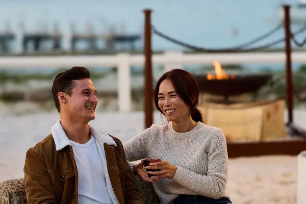 Couple sitting by the fire