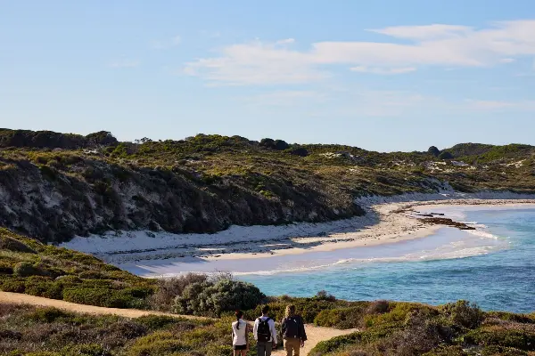 A group of hikers walking along the coast of Rottnest Island